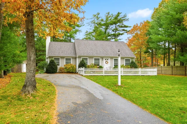 a front view of a house with a yard porch and furniture
