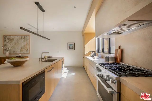 a kitchen with a stove and a sink