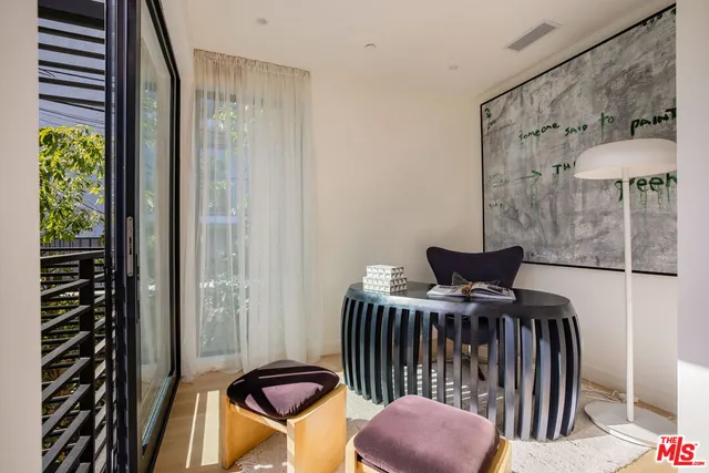 a view of a balcony with furniture