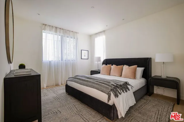 a bedroom with a bed and walk in closet