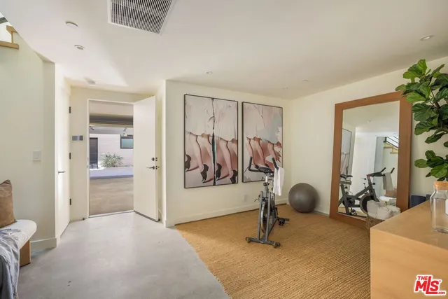 a view of a livingroom with furniture and a ceiling fan