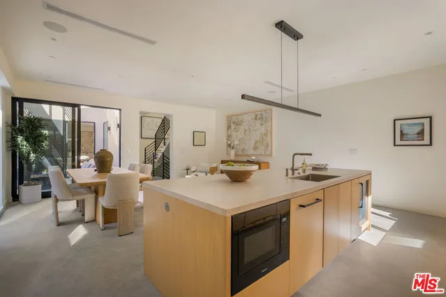 a view of living room with granite countertop furniture and a chandelier