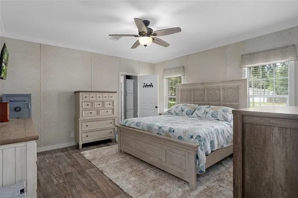 a bedroom with a bed and a dresser