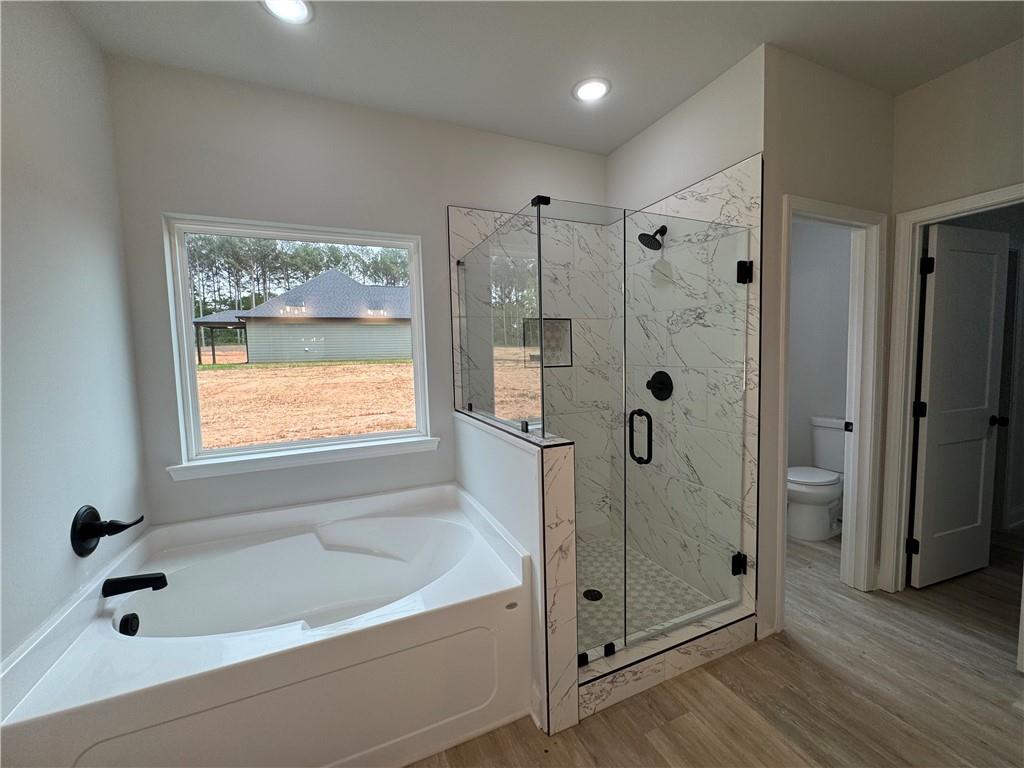 2057 North Hicks Road Toccoa, GA 30577 - Photo 17 of 22 a bathroom with a bathtub and a shower