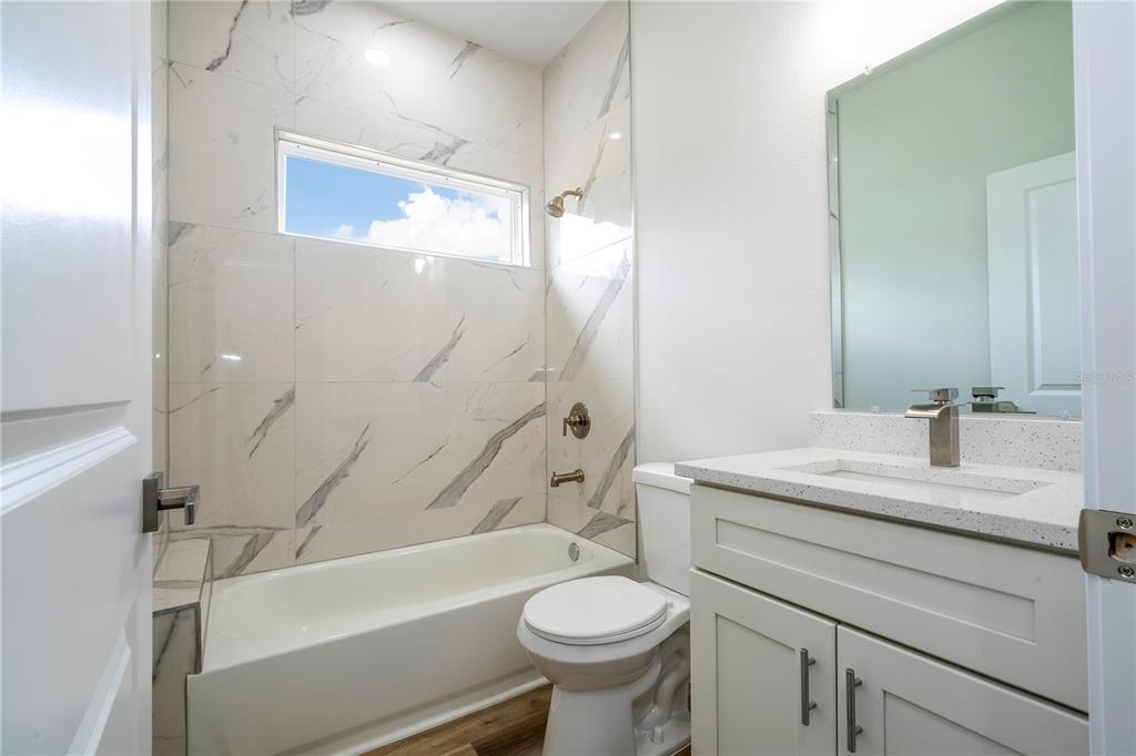 3970 Southwest 157th Place Road Ocala, FL 34473 - Photo 43 of 87 a bathroom with a sink a toilet and a bathtub