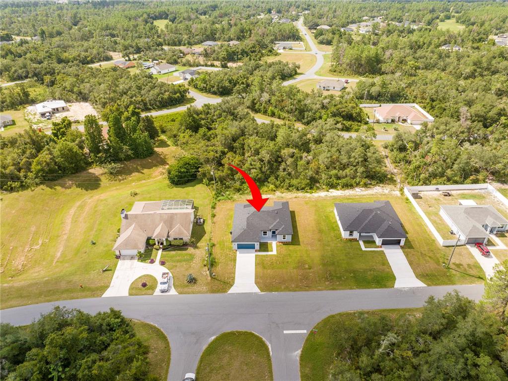 3970 Southwest 157th Place Road Ocala, FL 34473 - Photo 5 of 87 an aerial view of a house with swimming pool and ocean view