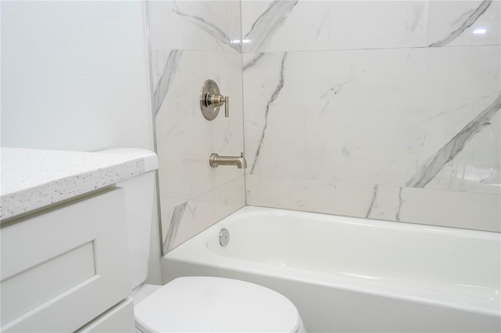 3970 Southwest 157th Place Road Ocala, FL 34473 - Photo 61 of 87 a bathroom with a toilet and a bathtub