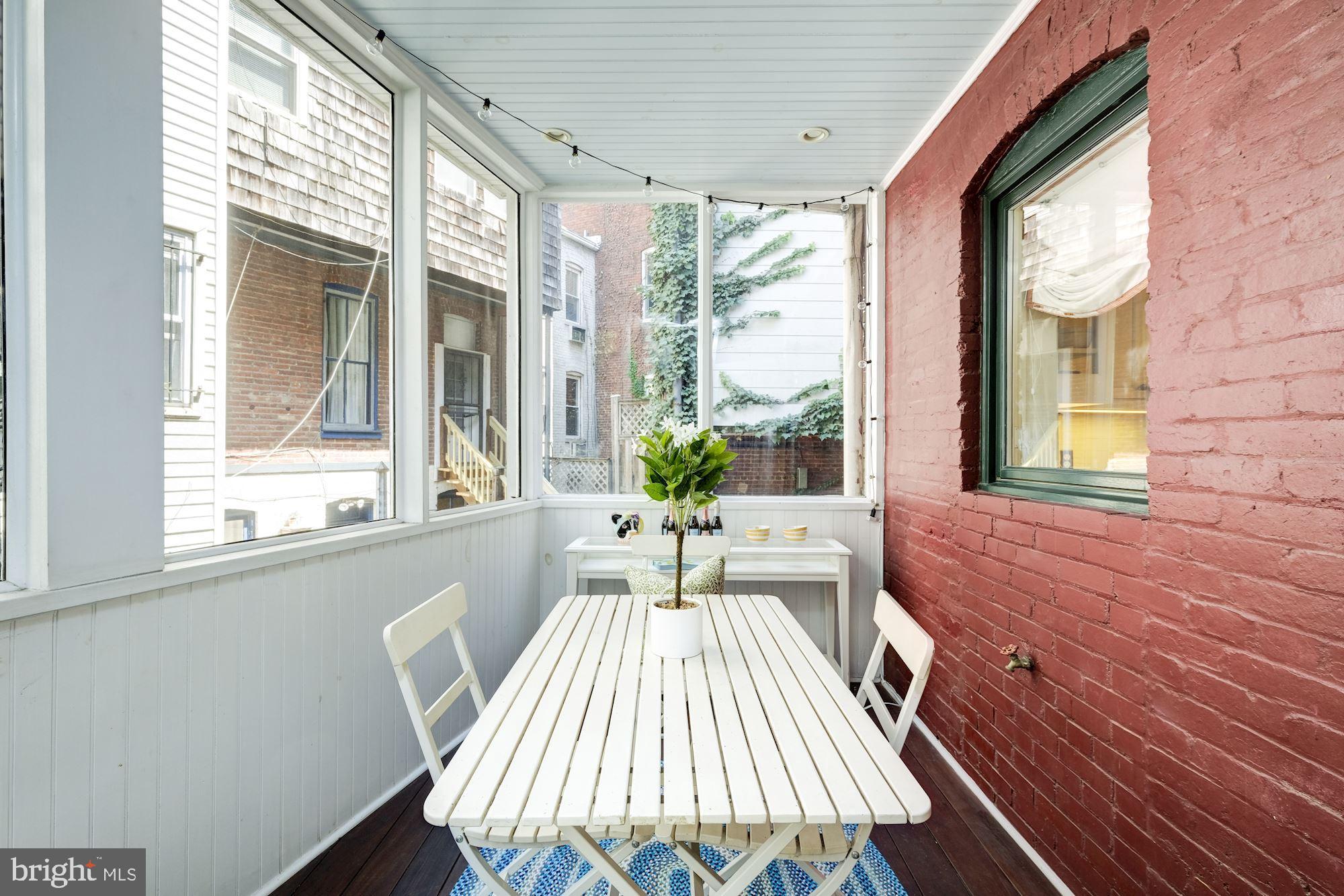 1008 East Capitol Street Northeast Washington, DC 20003 - Photo 9 of 24 Screened-In Porch Off Kitchen