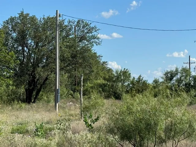 a view of a lake in between two of trees