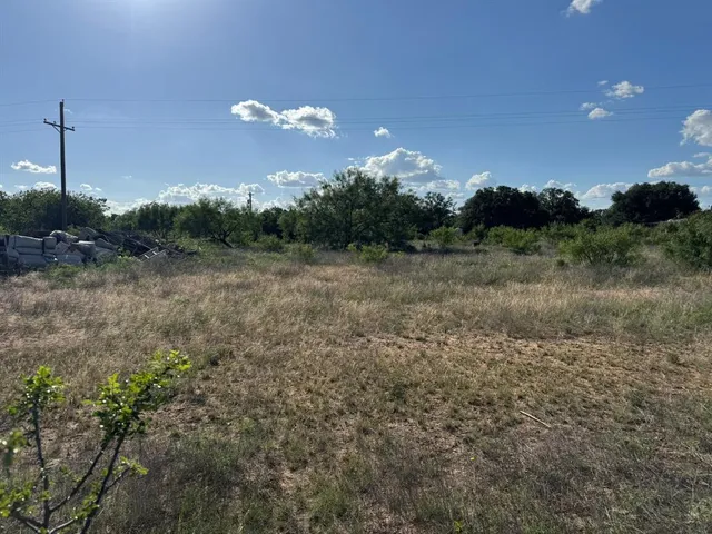 a view of mountain with green trees