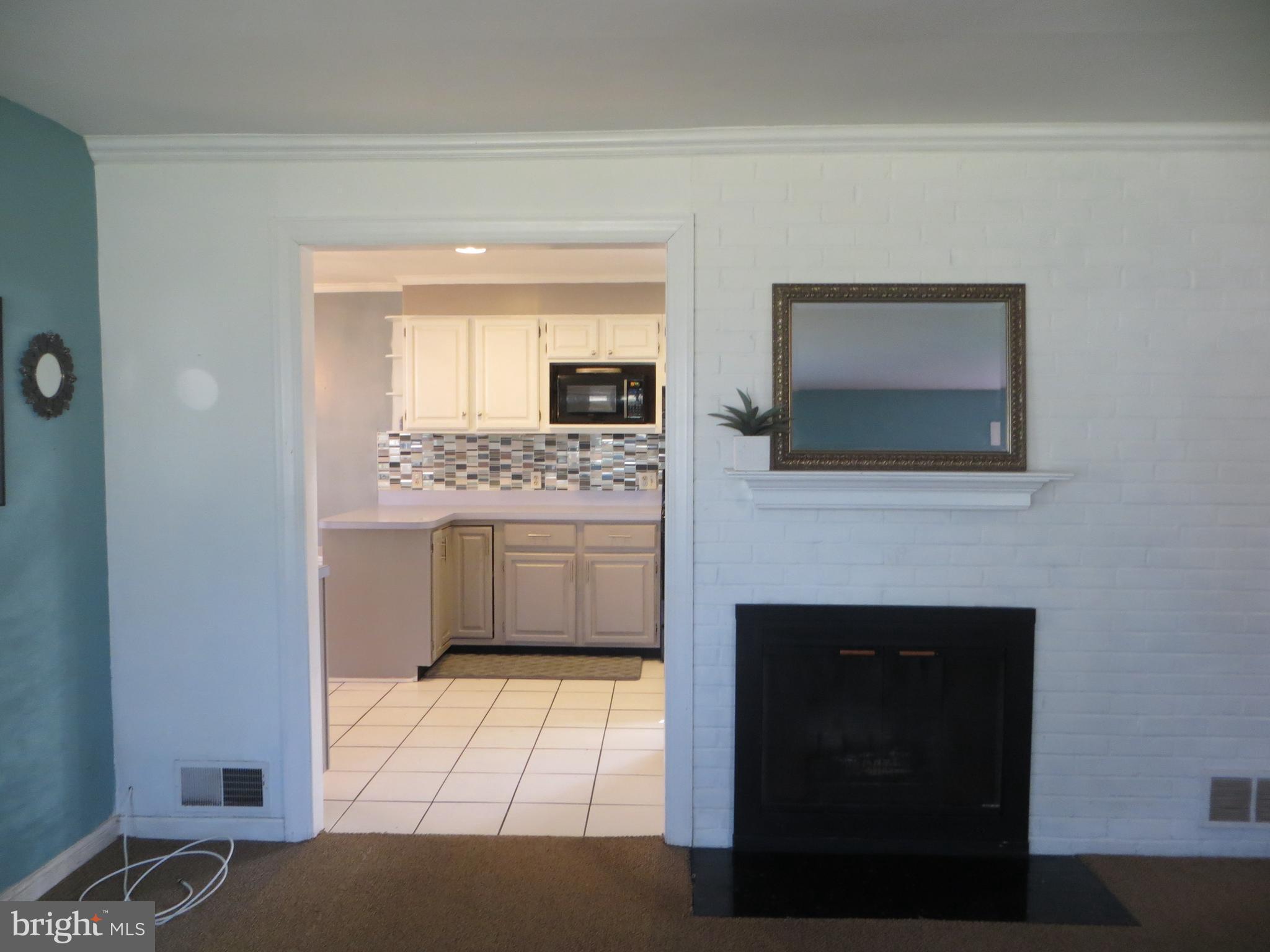 1405 Moffet Road Silver Spring, MD 20903 - Photo 9 of 15 Living Room with Fireplace