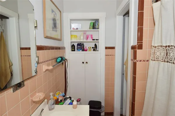 a bedroom with a bed and a closet