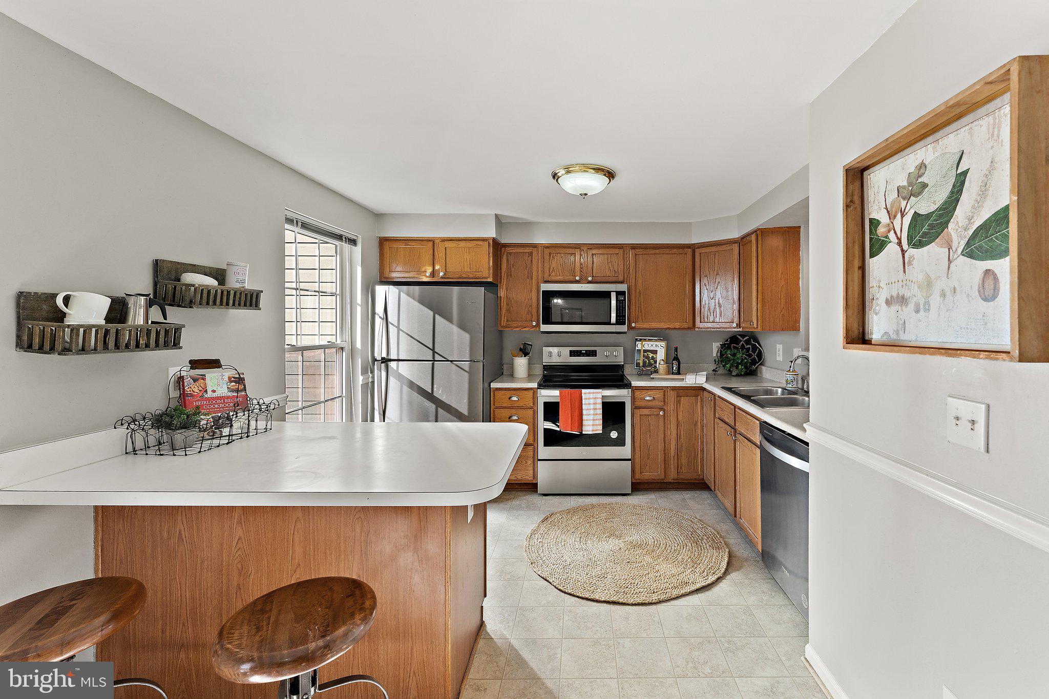 45304 Gable Square Sterling, VA 20164 - Photo 7 of 28 Sunny kitchen w/ window & door to deck.