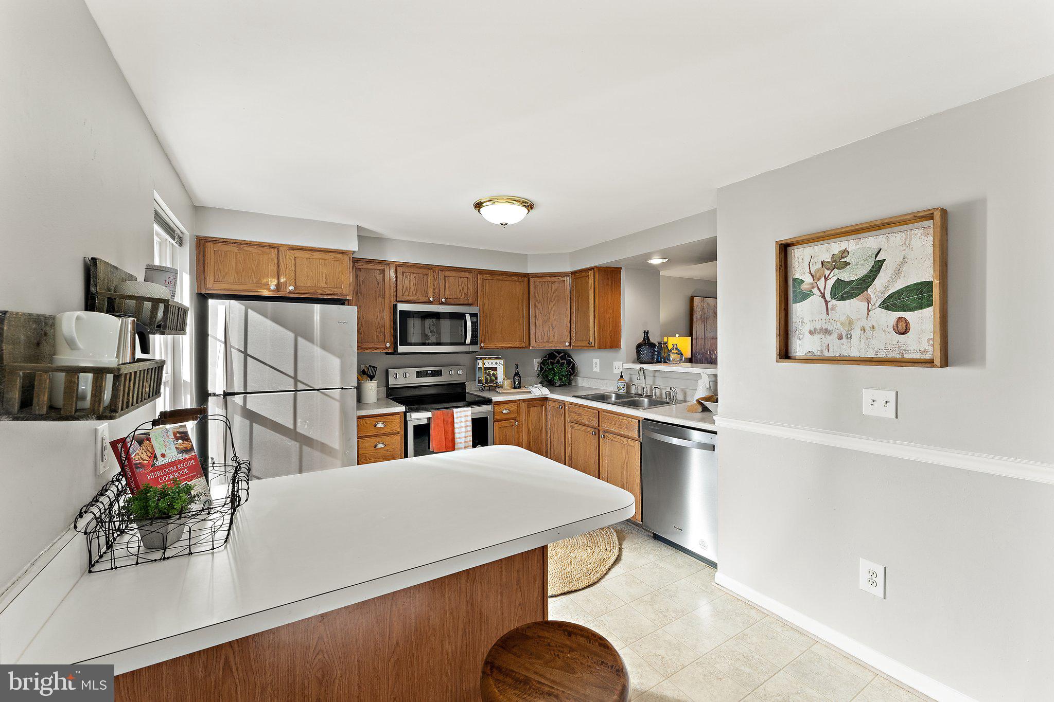 45304 Gable Square Sterling, VA 20164 - Photo 8 of 28 Island offers additional seating & work space!