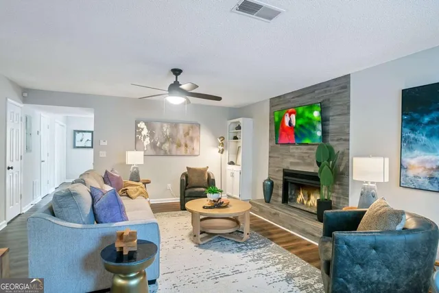 a living room with furniture and a fireplace