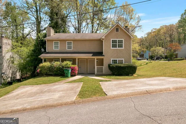 a front view of a house with a yard
