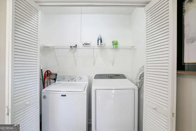 a utility room with dryer and washer