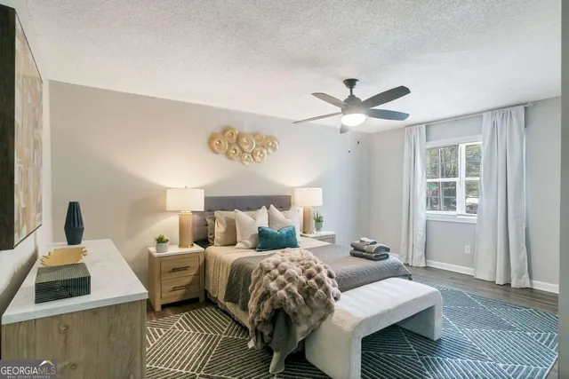 a bedroom with a bed and window