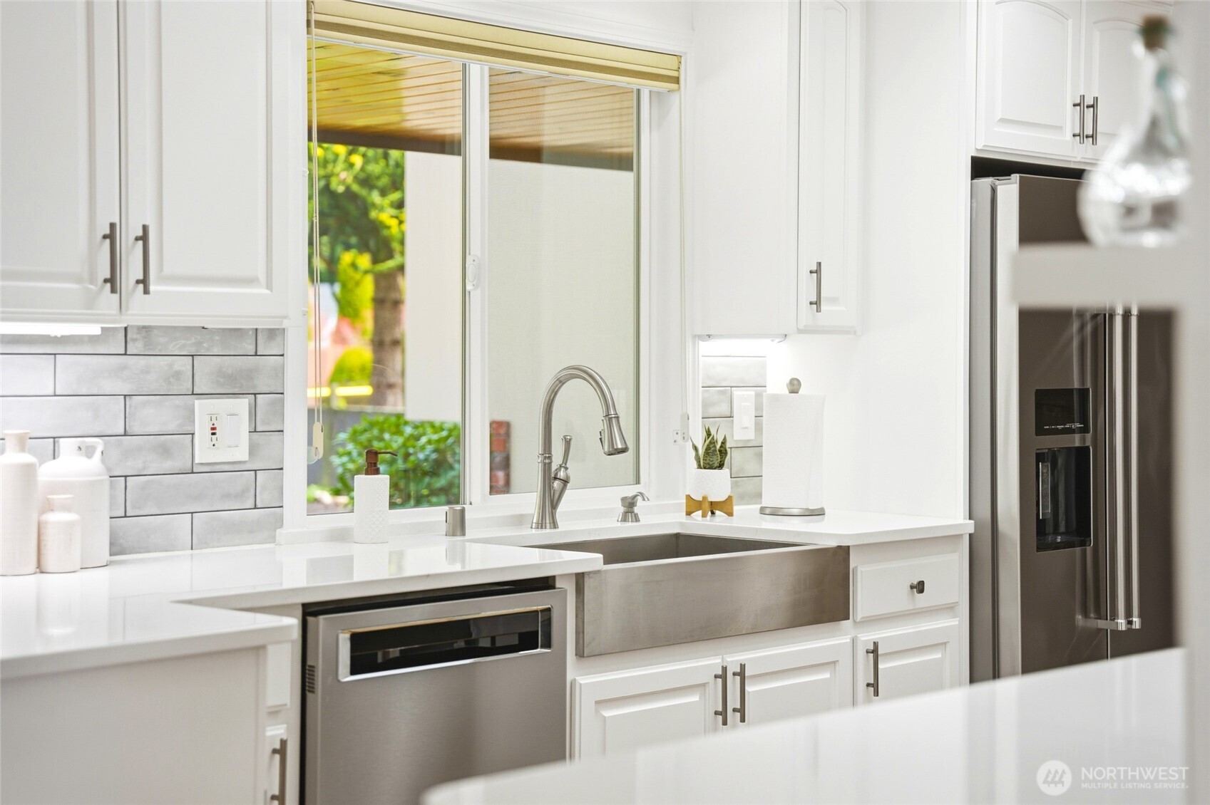 8910 56th Place West Mukilteo, WA 98275 - Photo 12 of 40 a kitchen with a stove a sink and a refrigerator
