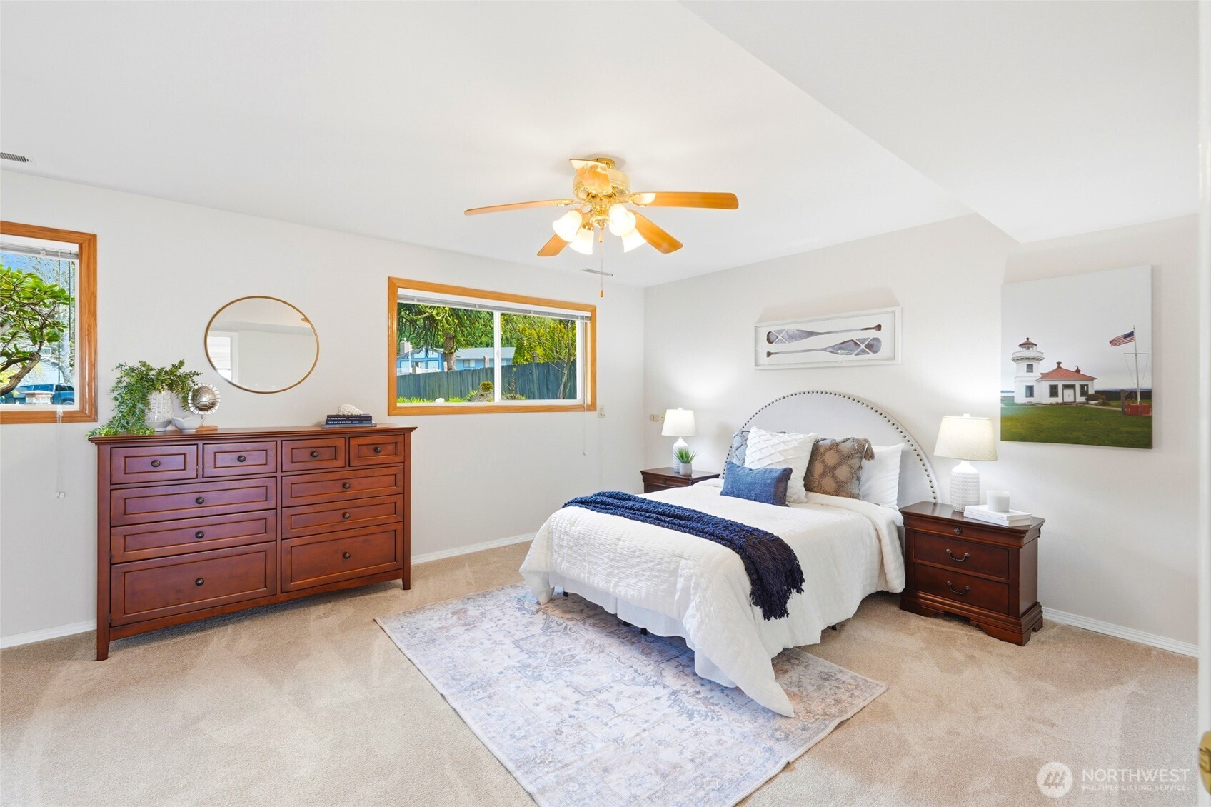 8910 56th Place West Mukilteo, WA 98275 - Photo 25 of 40 a bedroom with a bed and a chandelier