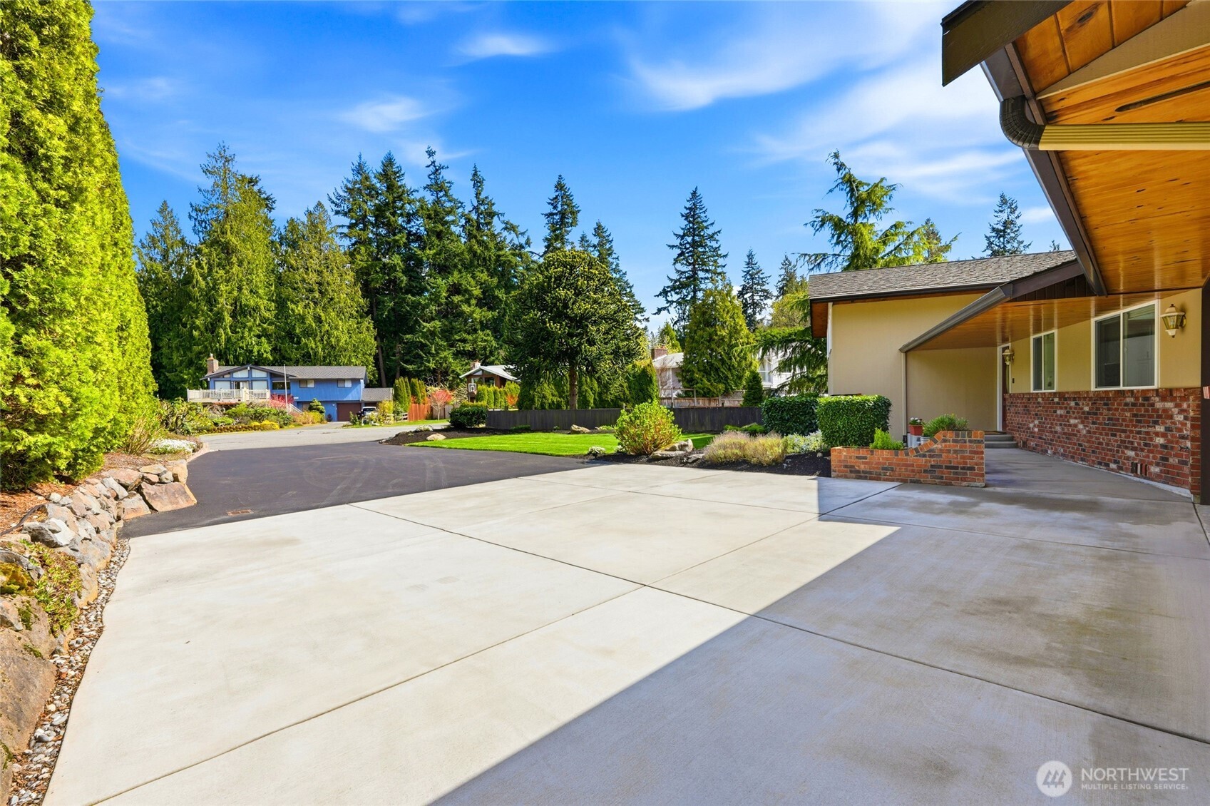 8910 56th Place West Mukilteo, WA 98275 - Photo 3 of 40 a view of a street with houses on both side