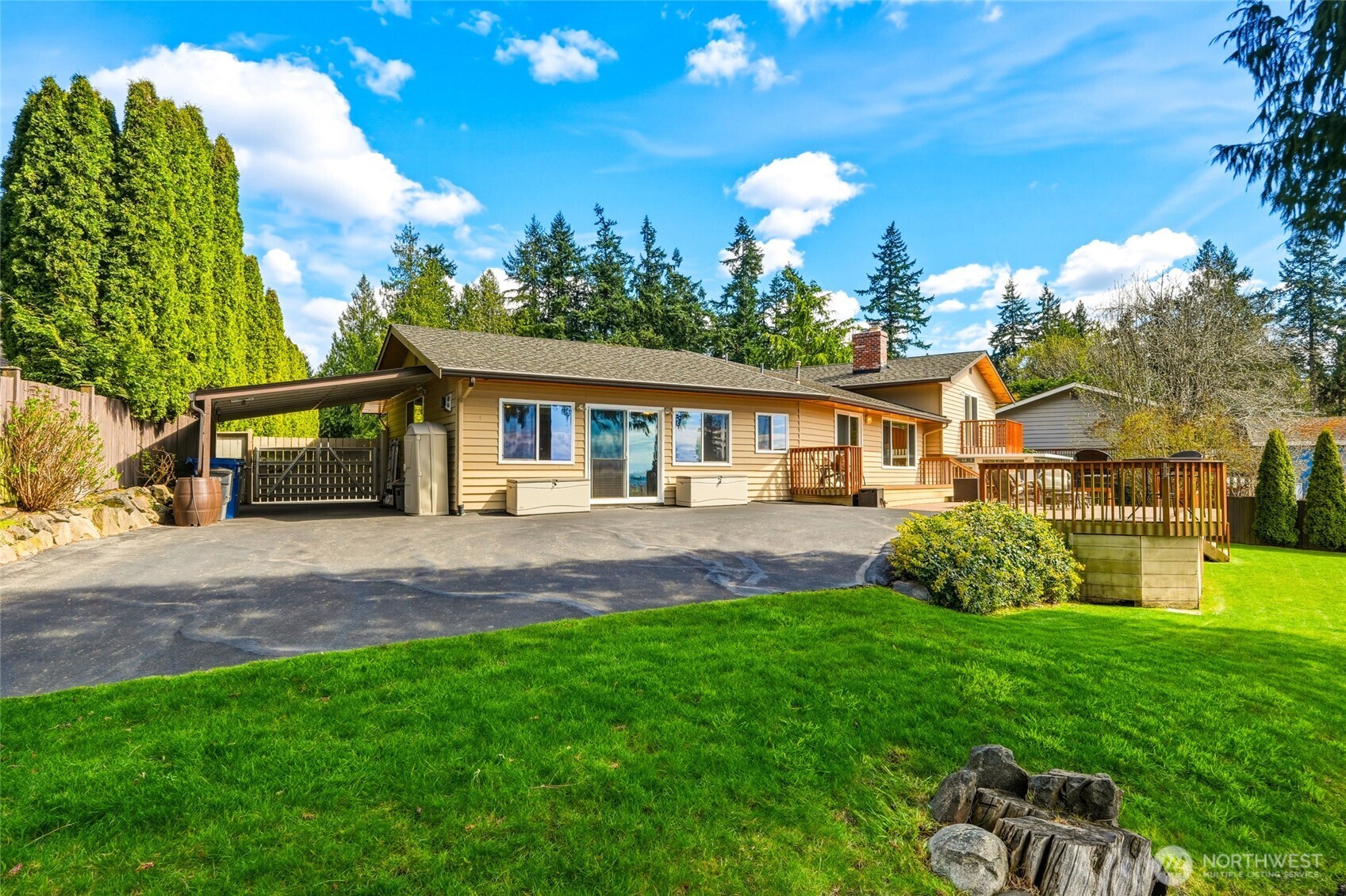 8910 56th Place West Mukilteo, WA 98275 - Photo 34 of 40 a front view of a house with a garden and porch