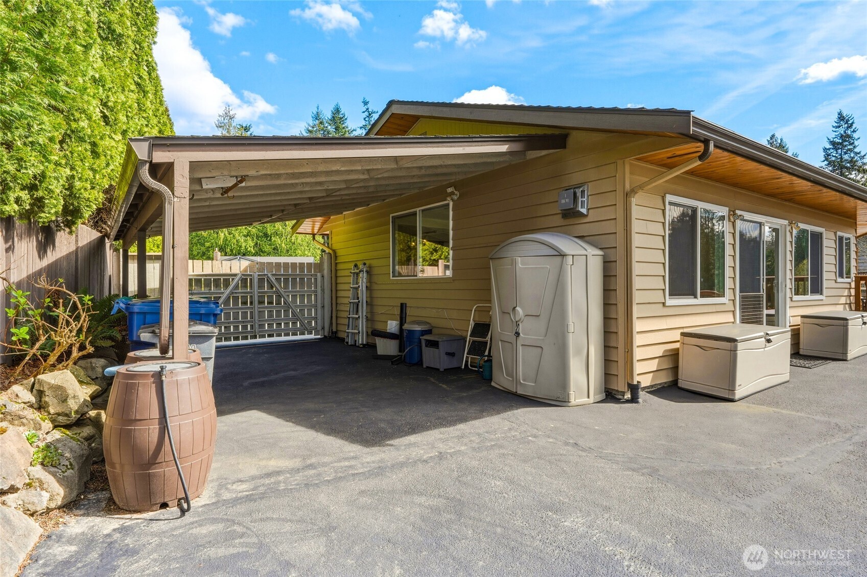 8910 56th Place West Mukilteo, WA 98275 - Photo 35 of 40 a view of a house with a large window and wooden fence