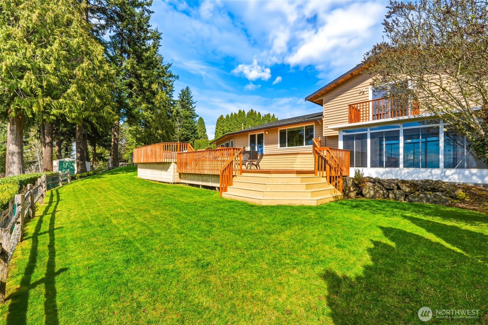 8910 56th Place West Mukilteo, WA 98275 - Photo 37 of 40 a view of a house with backyard and a tree