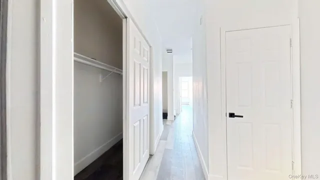 a view of a bathroom from a hallway