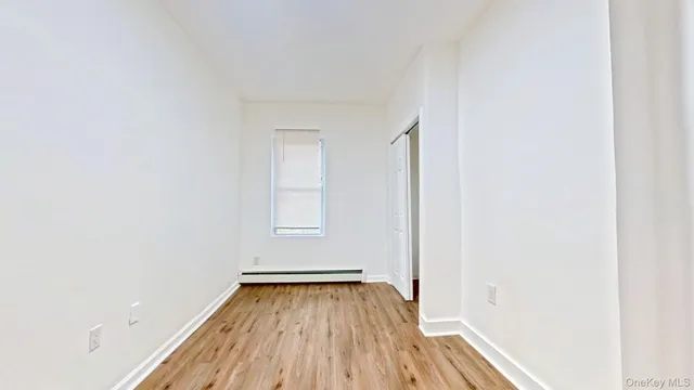 a view of a room with wooden floor and small space