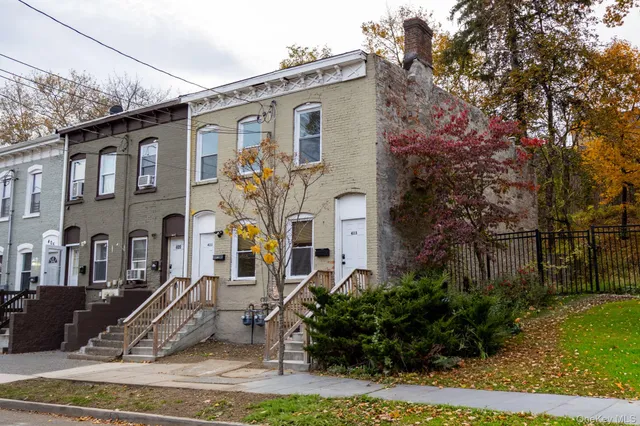 a front view of a house with garden
