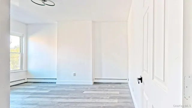 a view of a livingroom with wooden floor