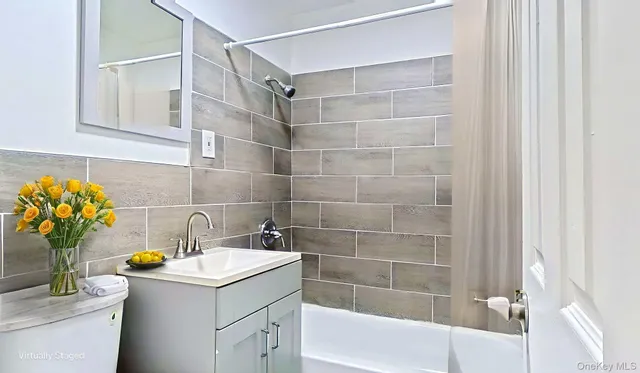 a bathroom with a sink a mirror and a shower