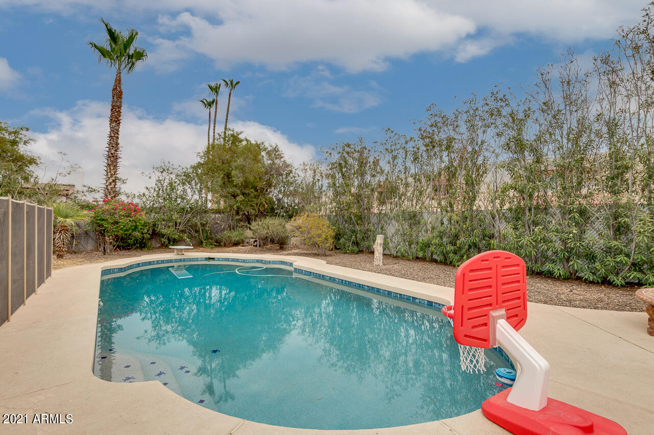 4215 West Dailey Street Phoenix, AZ 85053 - Photo 29 of 32 a swimming pool with a yard and seating space