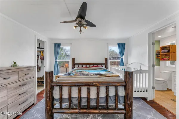 a bathroom with a granite countertop toilet sink and mirror