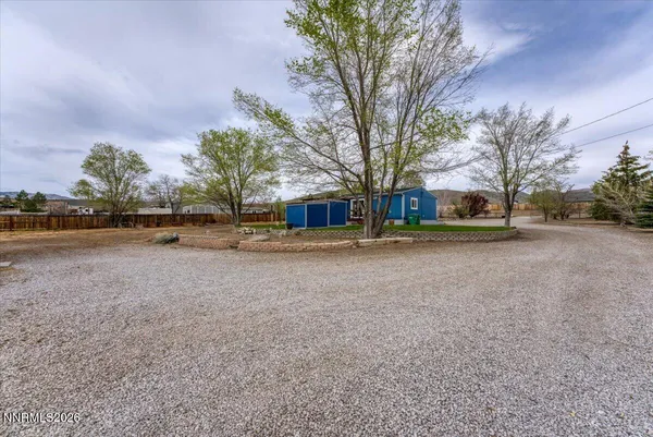 a house view with a sitting space and garden space