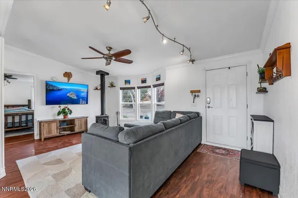 a living room with furniture and kitchen view