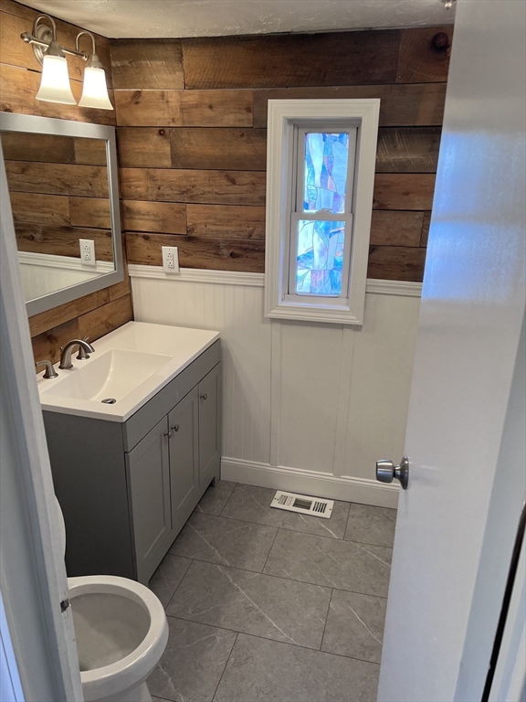 1032 North Main Street, Unit 7 Killingly, CT 06241 - Photo 2 of 9 a bathroom with a sink toilet and window