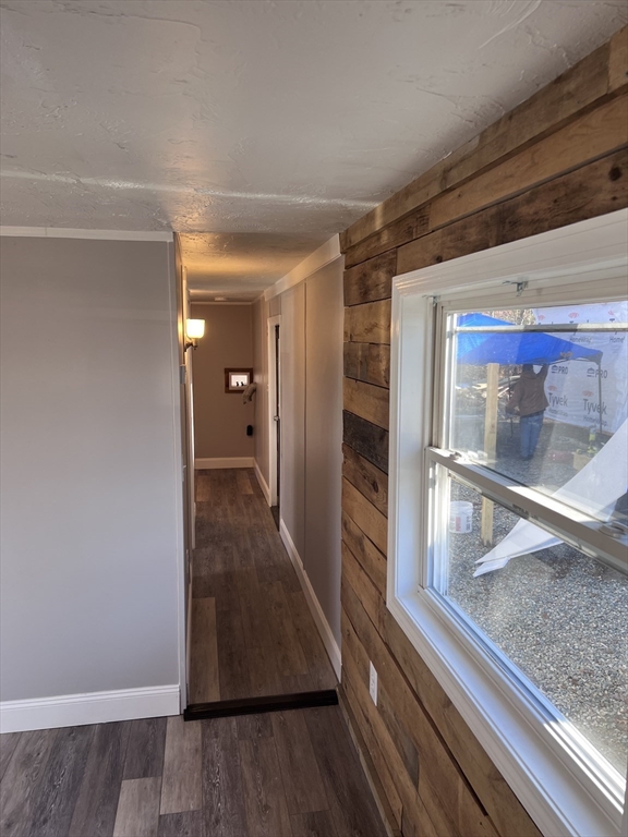 1032 North Main Street, Unit 7 Killingly, CT 06241 - Photo 5 of 9 a view of a hallway with wooden floor