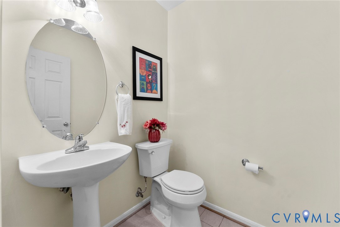 753 Blossom Tree Road Culpeper, VA 22701 - Photo 35 of 68 White pedestal sink with a chrome faucet, oval wal