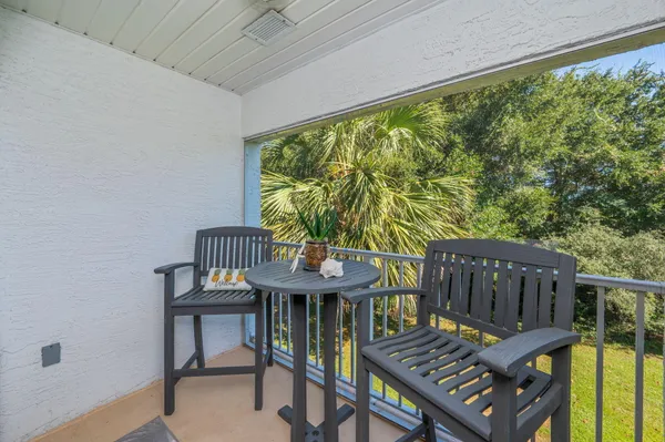 a view of a balcony with furniture