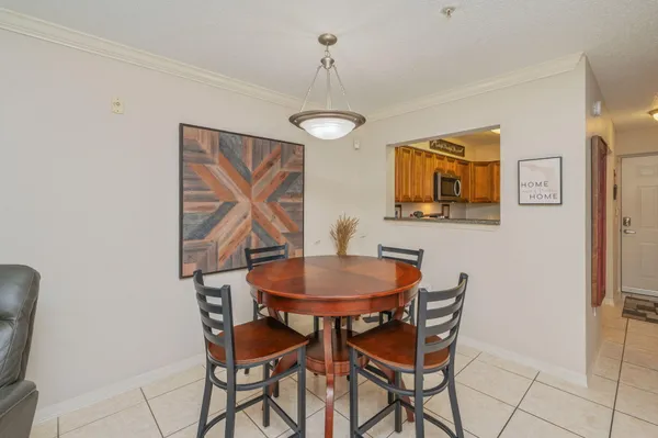 a dining room with furniture and window