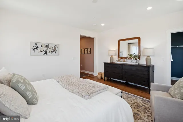 a bedroom with a bed and a couch