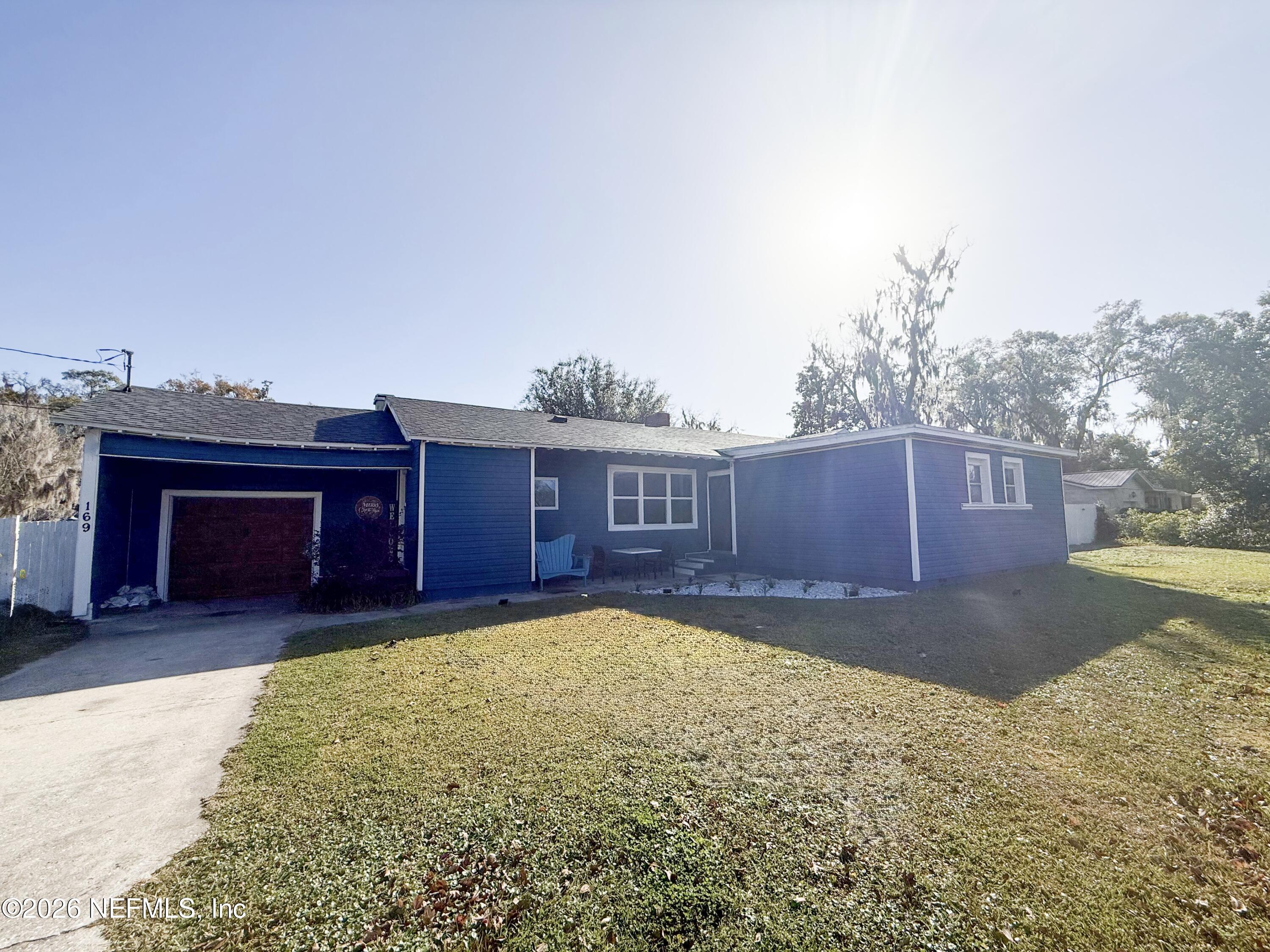 169 Center Street North Baldwin, FL 32234 - Photo 2 of 15 a view of a yard with a house