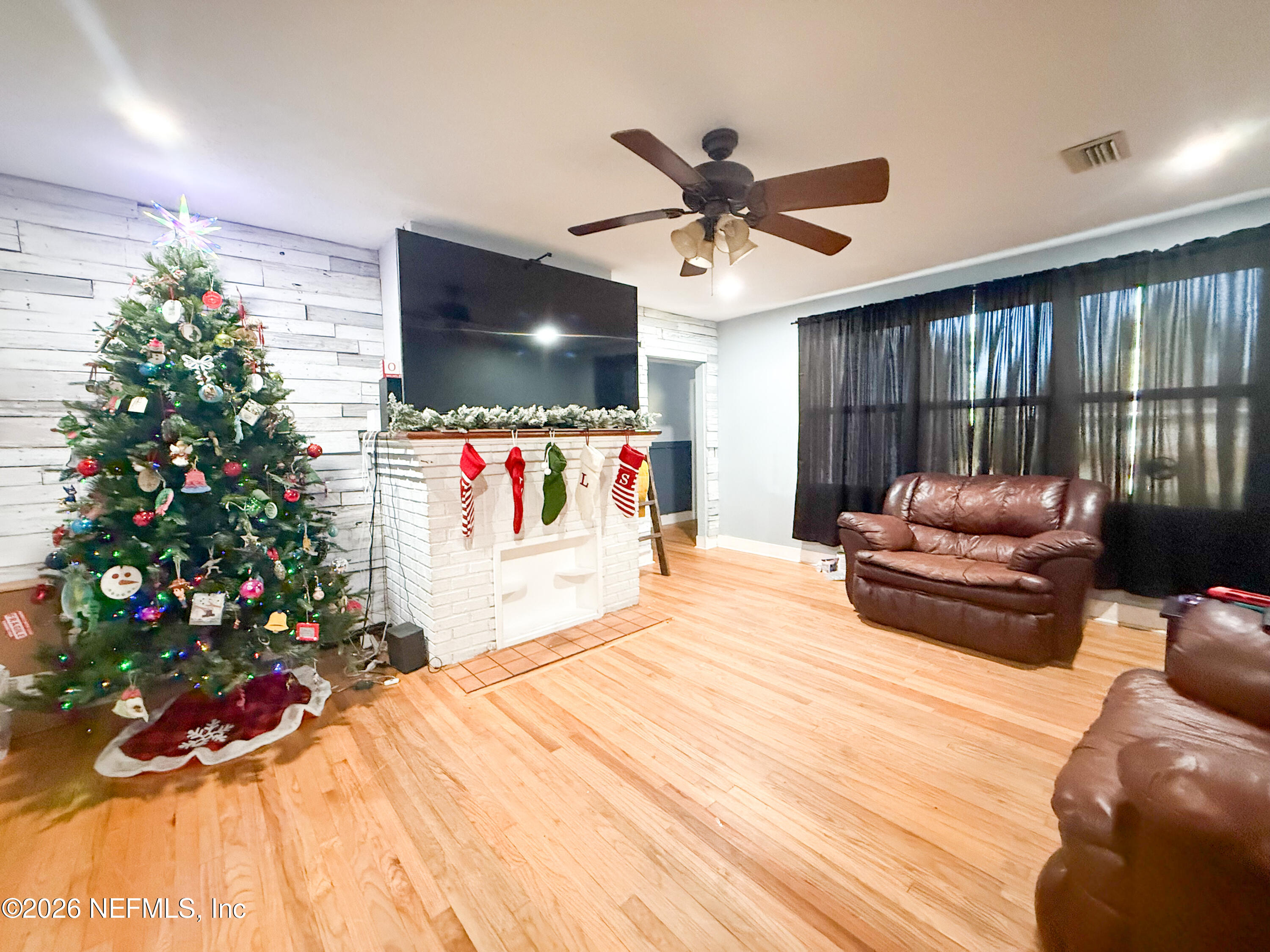169 Center Street North Baldwin, FL 32234 - Photo 6 of 15 a bedroom with a bed and a large window