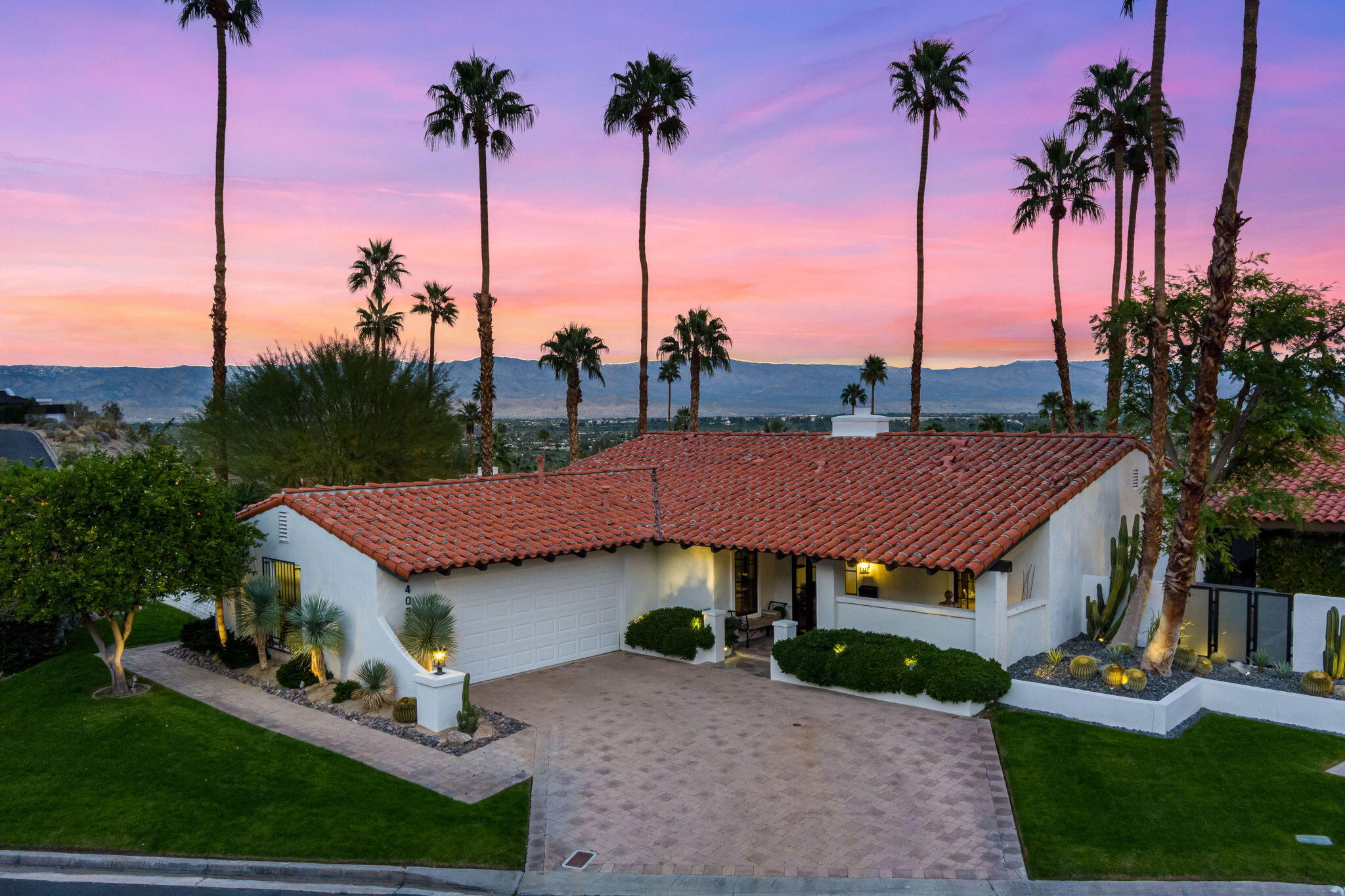 40320 Vía Entrada Rancho Mirage, CA 92270 - Photo 2 of 75 a view of a house with a yard and palm trees
