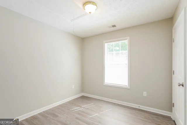 an empty room with windows