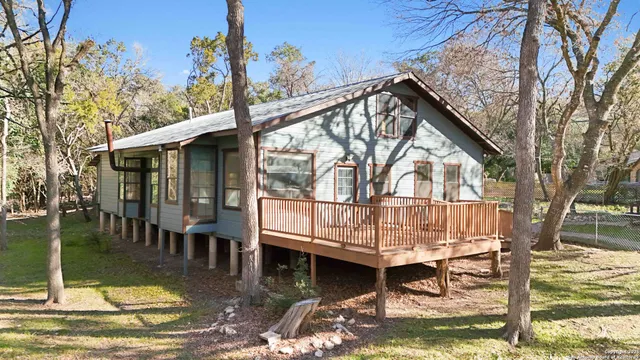 a view of a small house with roof deck