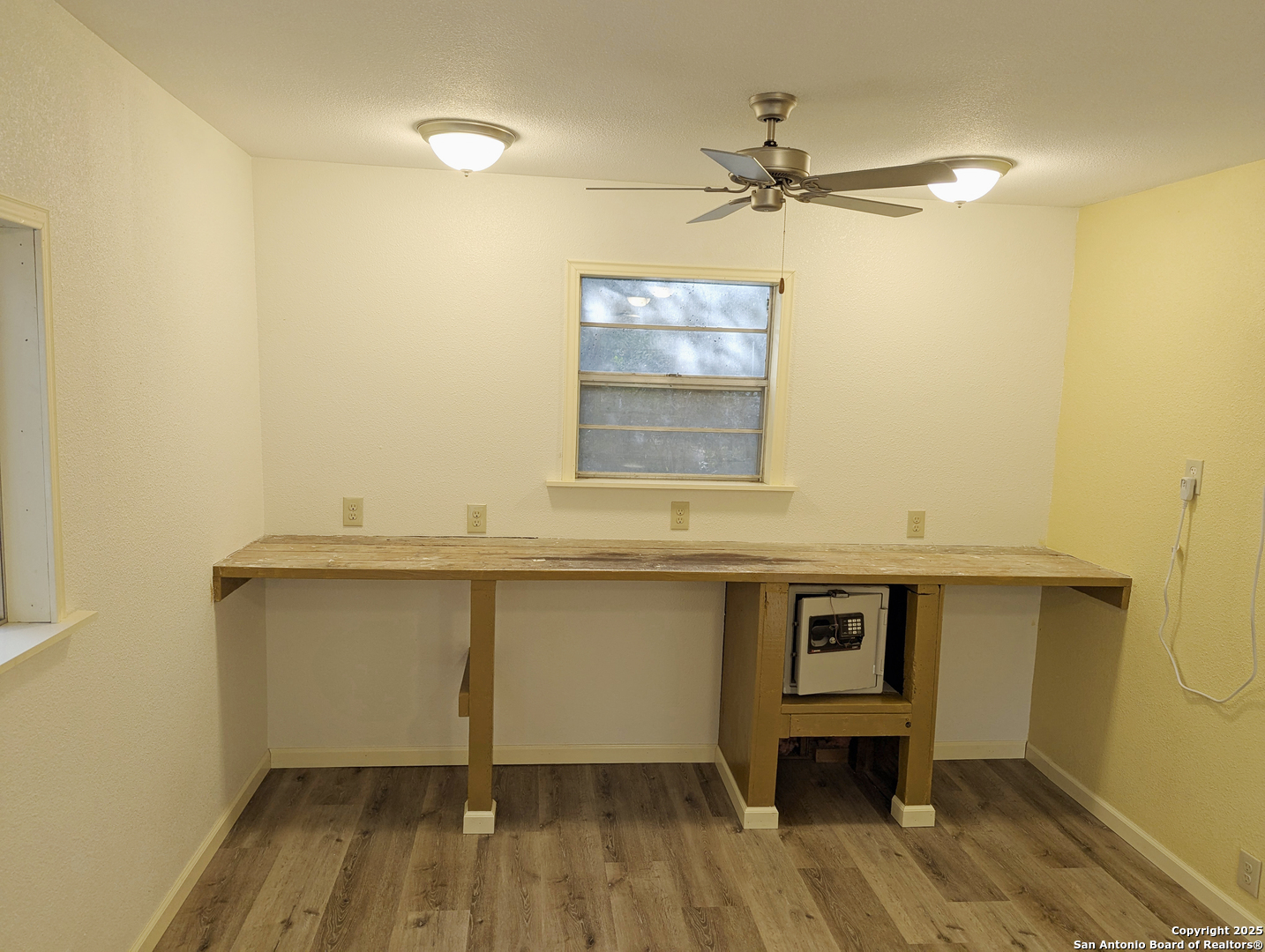19517 Scenic Loop Road Helotes, TX 78023 - Photo 32 of 55 a room with a wooden floor and a sink