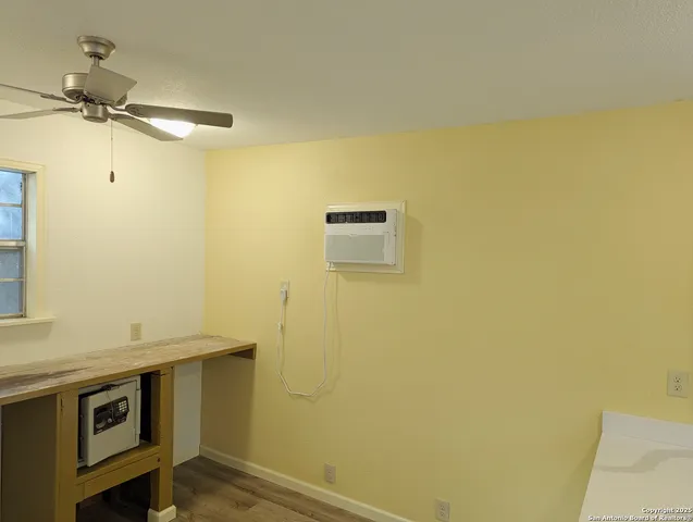 a bathroom with a tub a sink and glass door